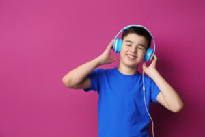 Teenager with headphones listening to music