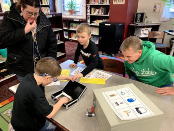Students solving a puzzle with BreakoutEDU