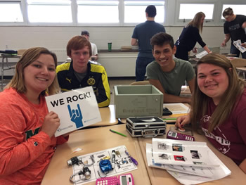 a group of students collaborating to solve a BreakoutEDU challenge