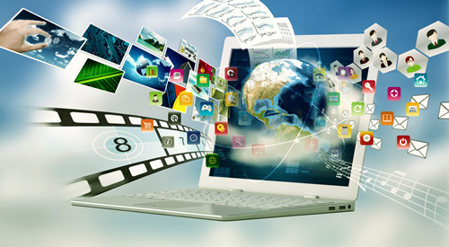 a laptop with videos, images, and all sorts of design tools around it