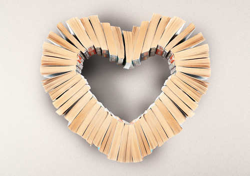 a group of books shaped into a heart