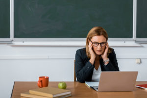 A stressed teacher shows how important strategies are to help educators navigate their first year of teaching with success and enthusiasm