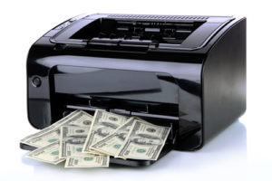 A printer printing money illustrates the concept of how printing processes can be amended to find funding for student programs.