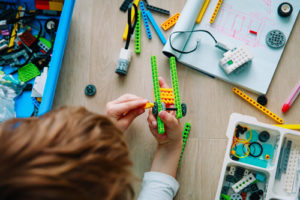 Robotics education is growing, as evidenced by this student using a robotics kit in technology class.