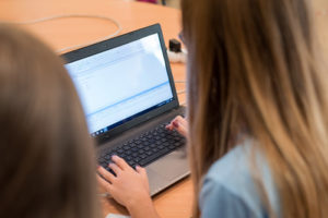 The Hour of Code grows each year, and, most importantly, it gets more and more kids coding--join in, like this young girl programming.