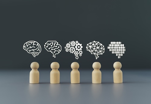 How can educators stay connected to how the work is actually experienced and carried out in schools if they move to a district role?