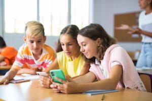 Are we trying to eliminate cell phones in classrooms, or are we trying to teach responsible use via school device policies?